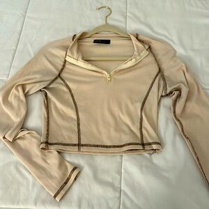 cream/brown top. size medium. sporty crop top.